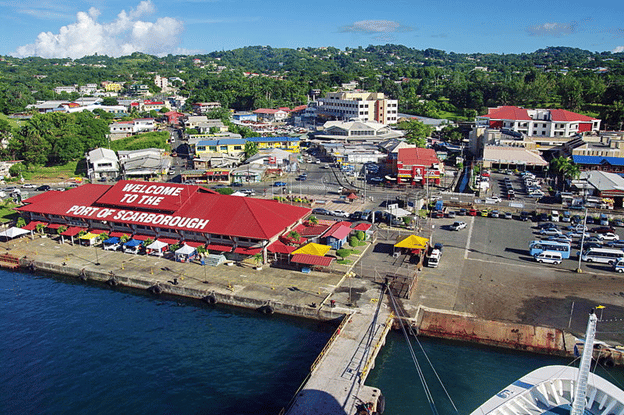 View from a ship docked in Scarborough showing the pier, the cruise terminal and a few city buildings located within walking distance.