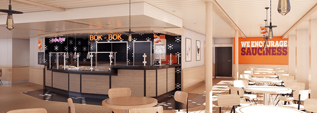 Counter restaurant with a few tables sitting off to the side