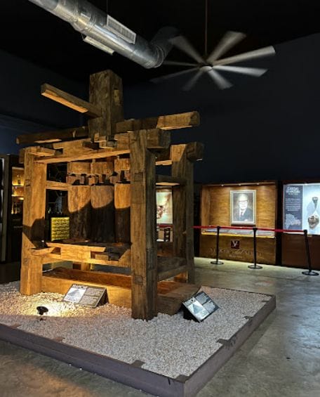 Inside of the Macorix House of Rum museum. An exhibit with plaques and photos.