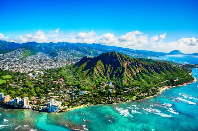 Hawaii aerial view with large mountains and blue waters